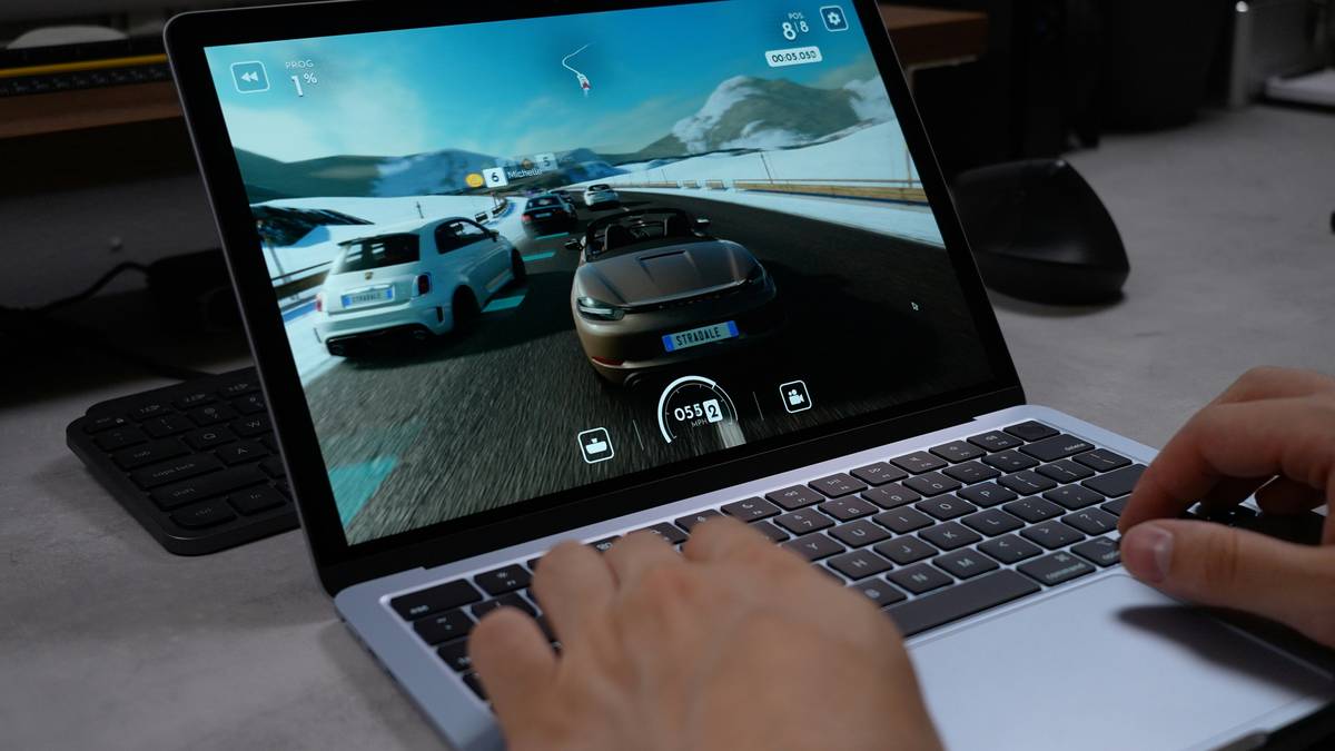 Family playing online virtual simulation games together on tablet showing joyful interaction